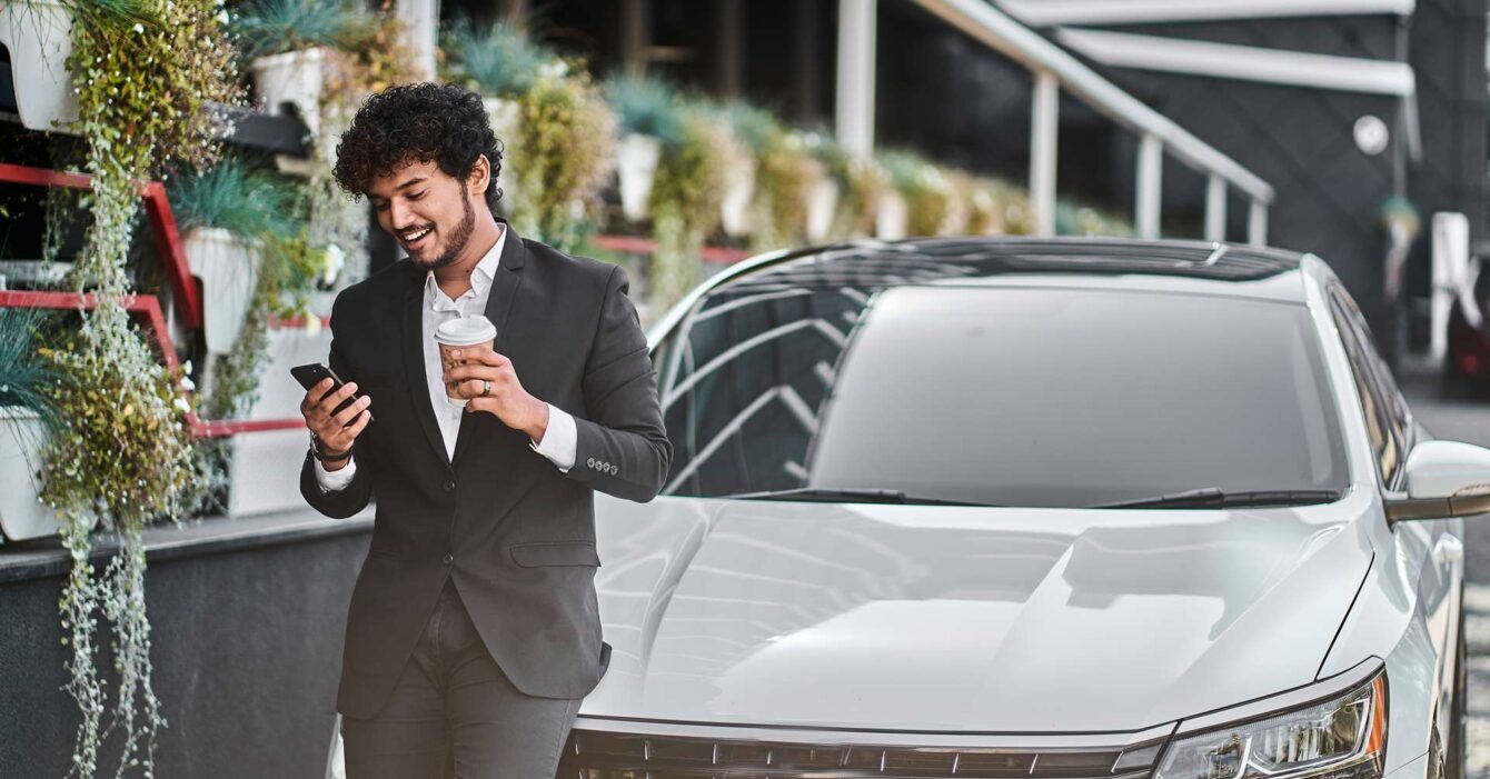 curly-haired-businessman-from-india-drinks-coffee