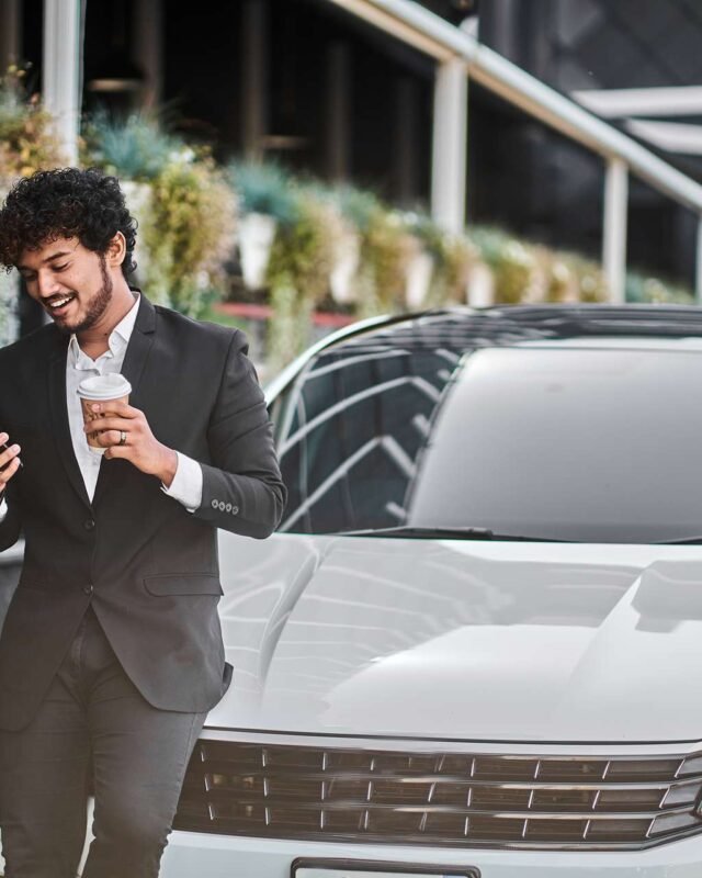 curly-haired-businessman-from-india-drinks-coffee